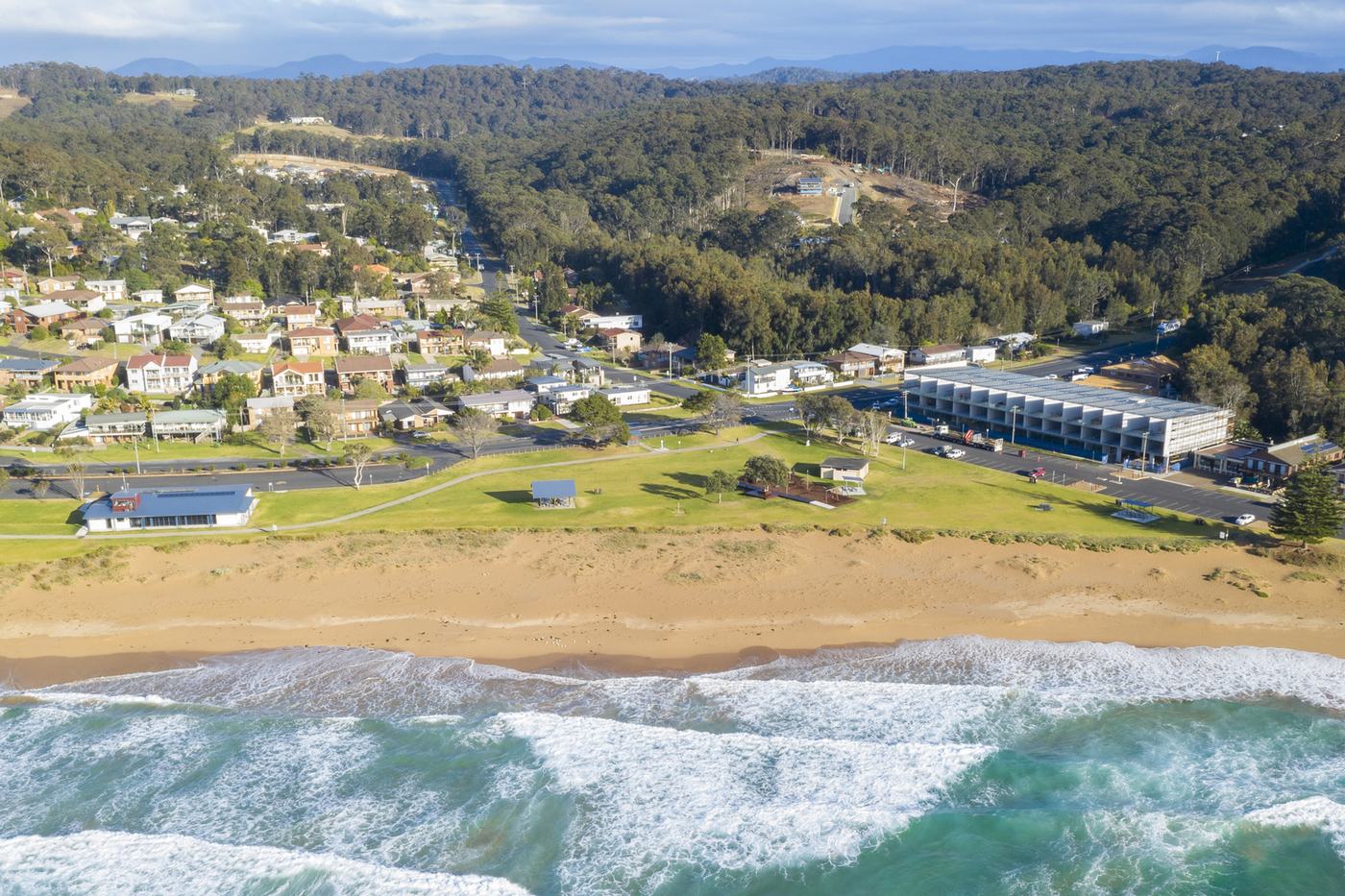 Aerial view over the headland and beach at Malua Bay