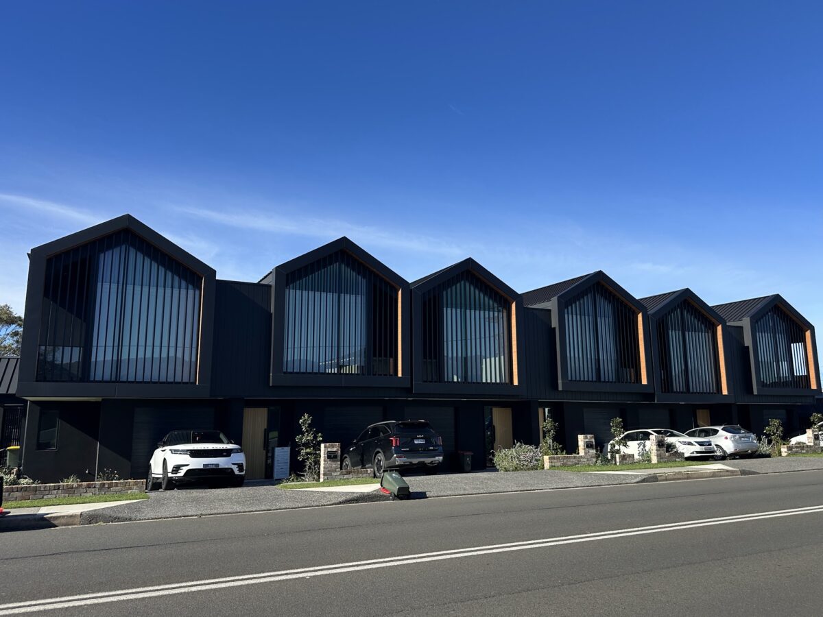 Modern black and timber townhouses at Towradgi in the northern suburbs of Wollongong
