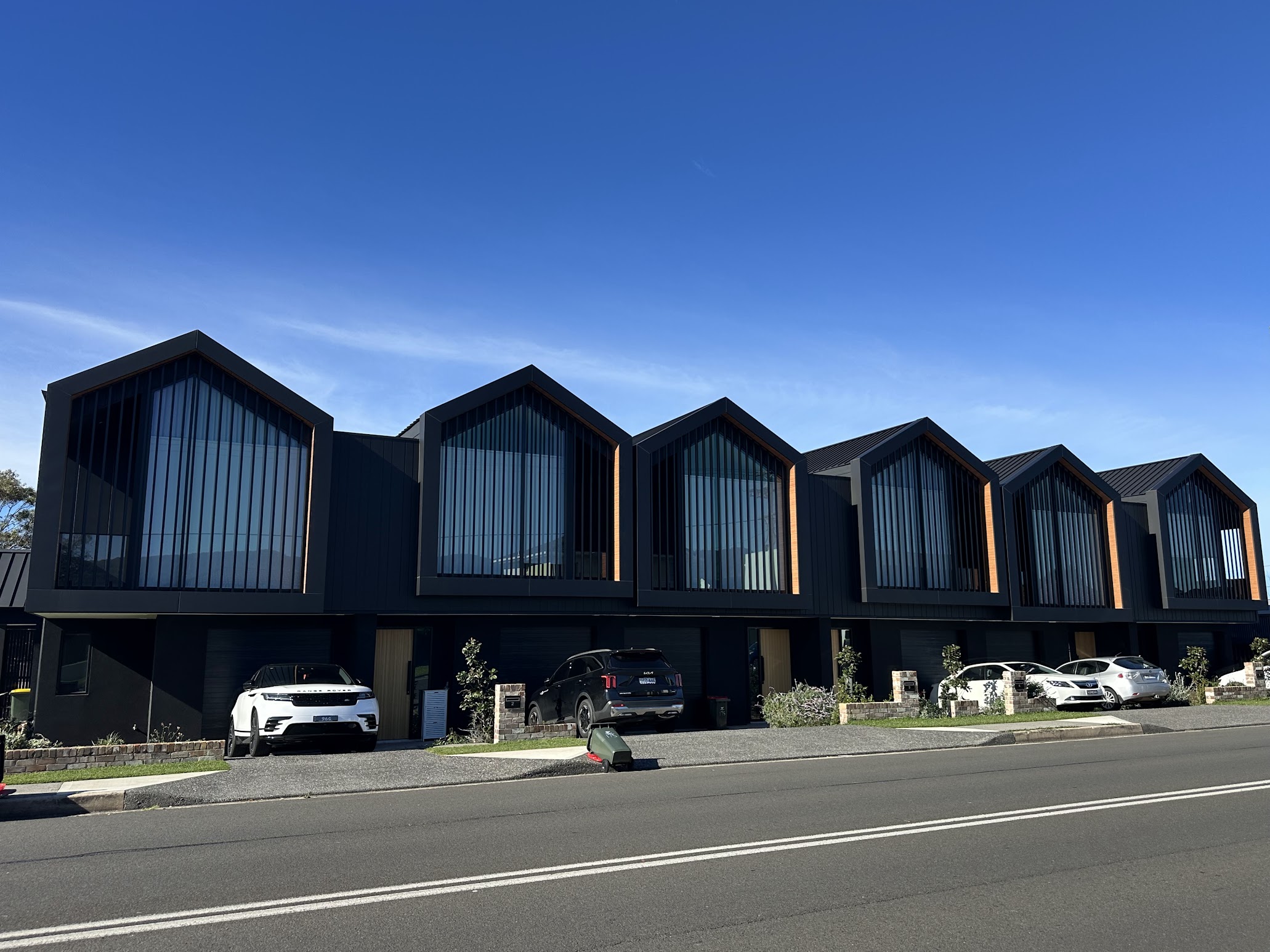 Modern black and timber townhouses at Towradgi in the northern suburbs of Wollongong